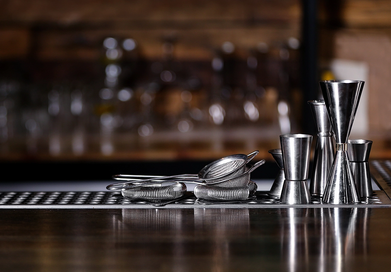 Bar tools and cocktail strainers on a counter at a cocktail bar KL venue, reflecting the city’s evolving cocktail culture